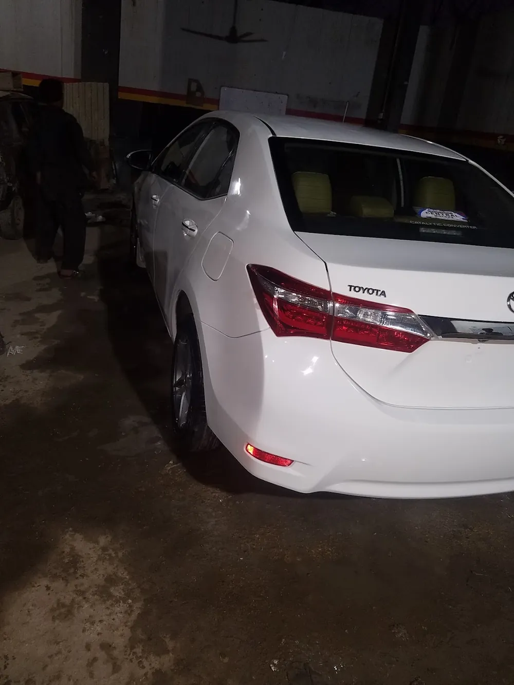 White Toyota Corolla after polish in the workshop