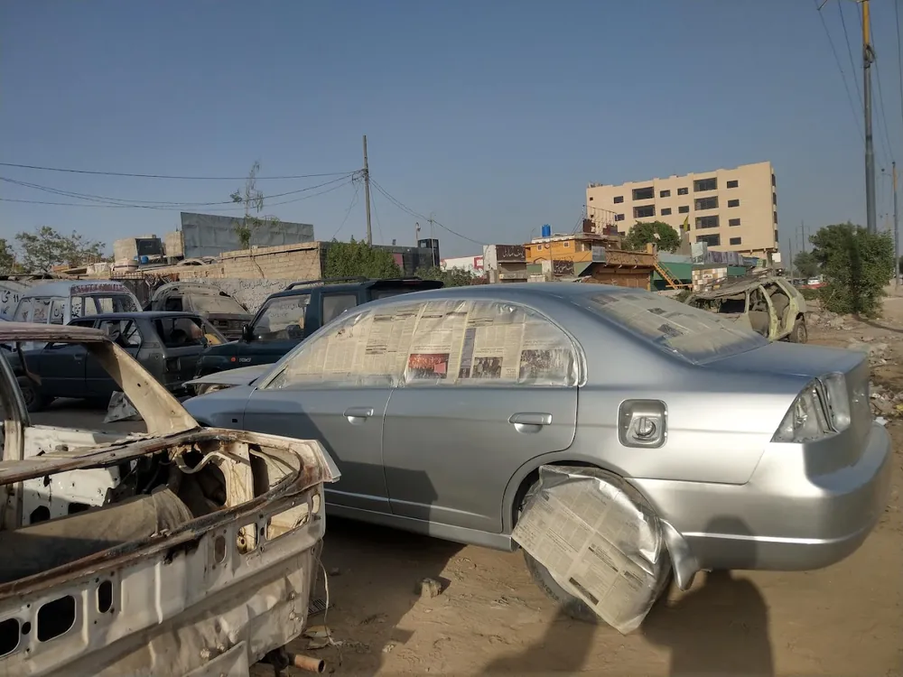 Silver sedan with rebuilt rear quarter